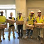 Workers receiving their boxes for their corporate wellness initiative